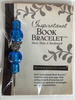 Packaged Inspirational Book Bracelet featuring bright sapphire blue glass disc beads, square glass accents, and a central silver butterfly spacer mounted on a branded backing card.