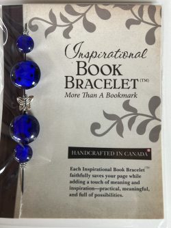 Packaged Inspirational Book Bracelet featuring rich cobalt blue disc beads, blue sphere accents, and a central silver butterfly spacer mounted on a branded backing card.