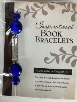 Packaged Inspirational Book Bracelet featuring rich royal blue disc beads, a vertical silver word bar engraved with "follow your heart", and blue accent sphere beads mounted on a branded backing card.